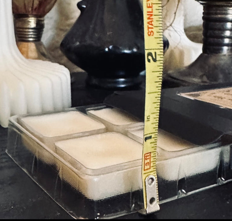 Packaged items with a measuring tape showing dimensions