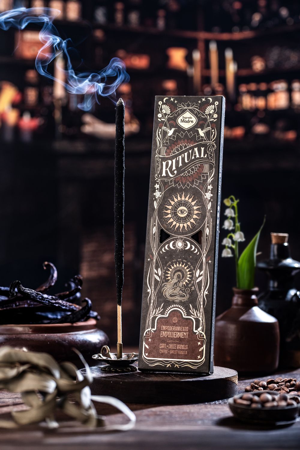 Decorative incense stick holder with intricate design on a dark background