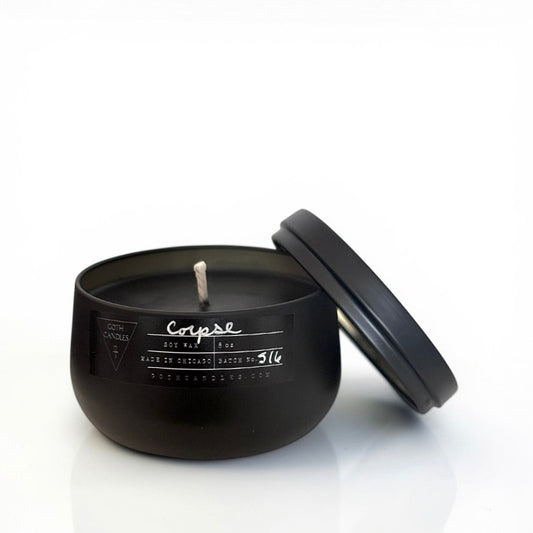 Black goth candle with lid on a white background