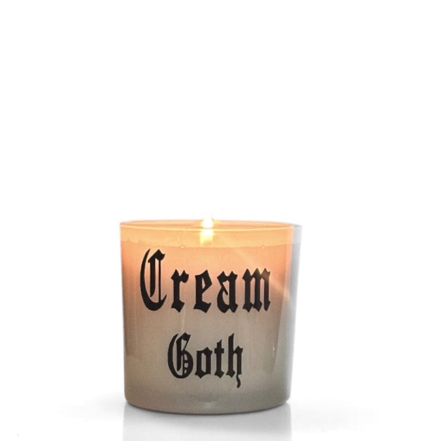 Candle with 'Cream Goth' text on a white background