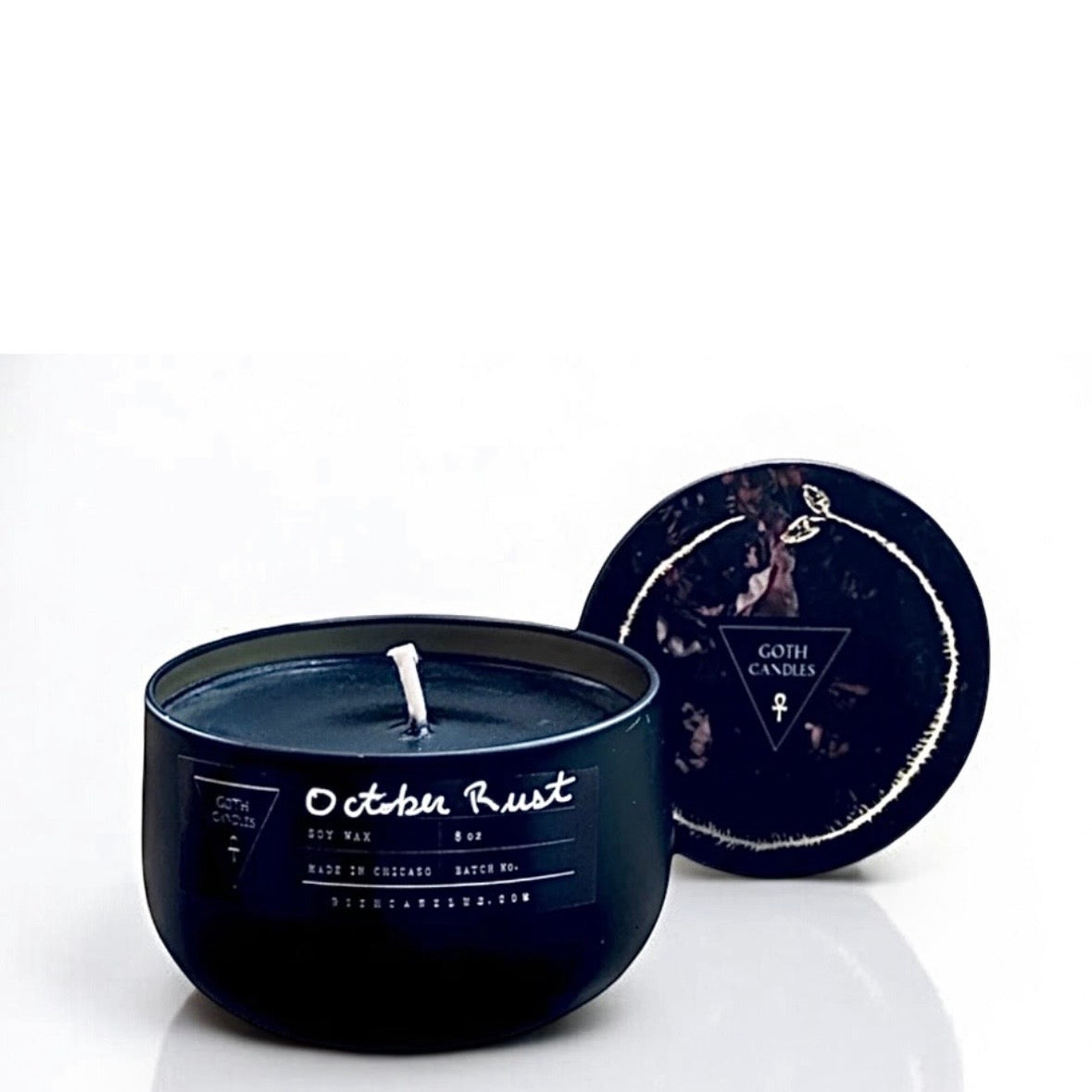 Black candle with a lid featuring a logo on a white background