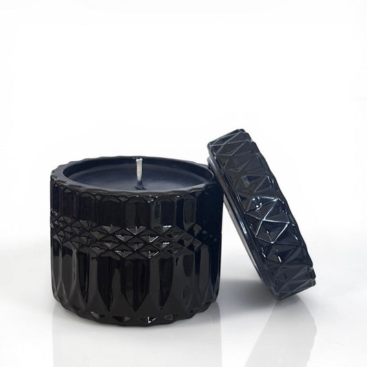 Black Goth textured candle with lid on a white background