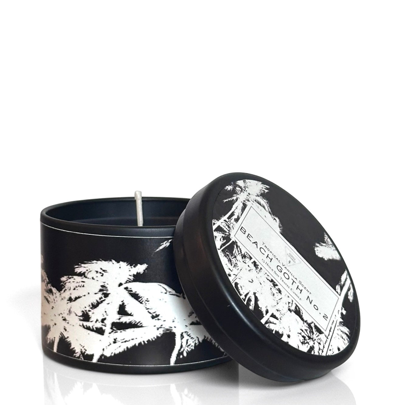 Black candle with white floral design and matching lid on a white background