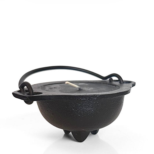 Black mini cast iron cauldron candle  on a white background