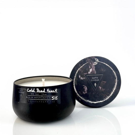 Black cold dead heart candle with decorative lid on a white background