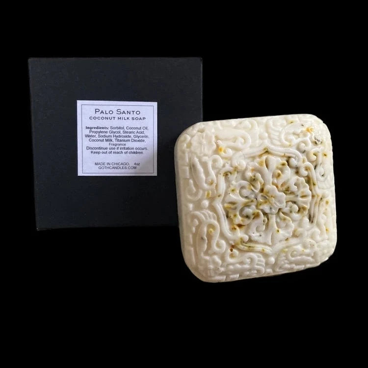 Bar of soap with a black box labeled 'Palo Santo' on a black background