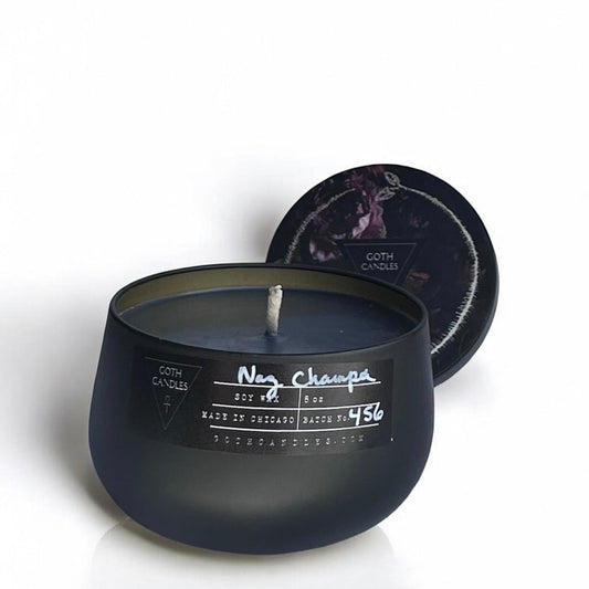 Black nag champs candle with a label on a white background