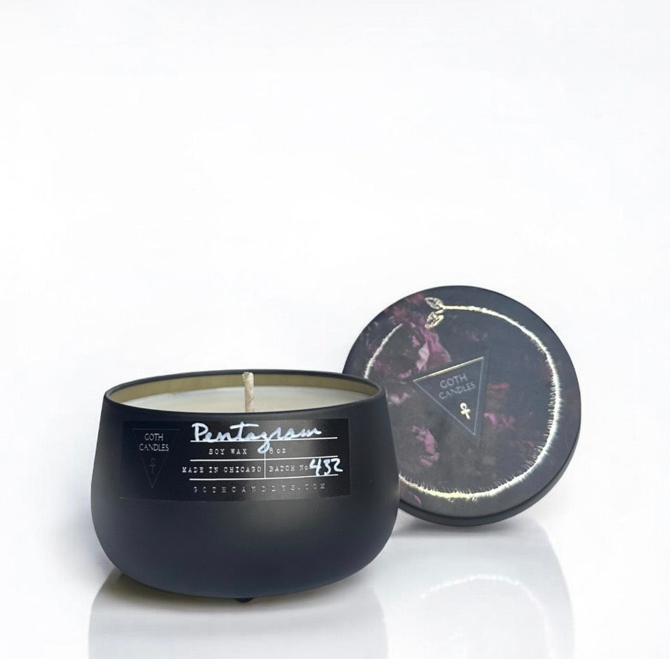 Black candle with a decorative lid on a white background