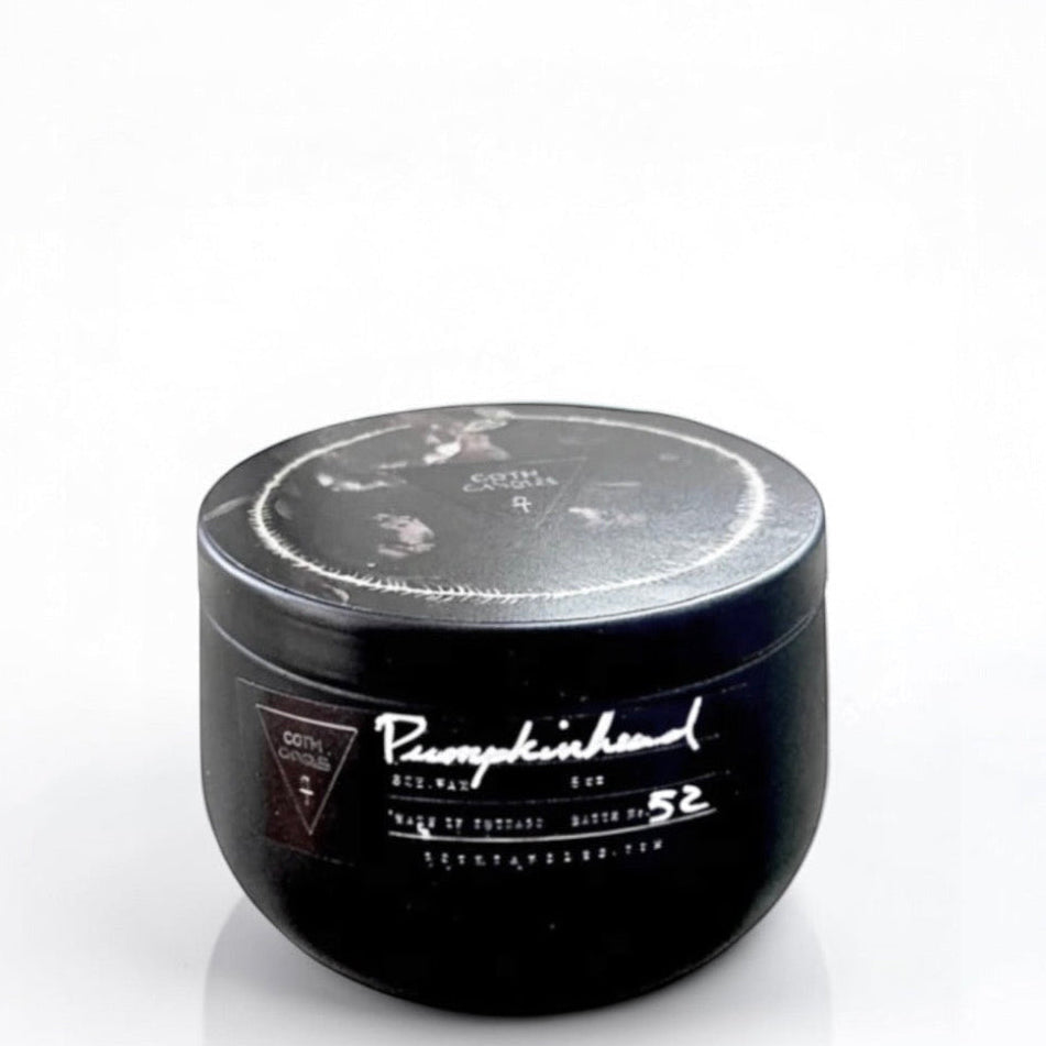 Black goth candle with a lid on a white background